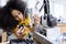 Girl with afro hairstyle wear yellow T-shirt engineer with robot for education on table at class room. Robotics learning