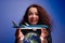 Girl with an airplane model in her arms over an earth globe. Concept of Airline help