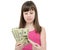 Girl in amazement holding money on white background