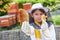 Girl analyzing honeycomb at apiary garden