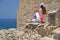 Girl among ancient ruines