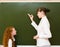Girl answers questions of teachers near a school board