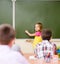 Girl answers questions of teachers near a school board