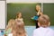 Girl answers questions of teachers near a school board