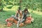 Girl with Apple in the Apple Orchard. Beautiful Girl Eating Organic Apple in the Orchard. Harvest Concept. Garden, teenager eating