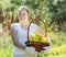 Girl with apples harvest in garden