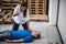 Girl assisting an unconscious man