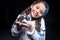 Girl astronaut holding plant