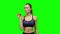 Girl athlete with apple. Green screen