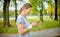 Girl athlete jogging in the evening park