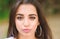 Girl attractive gorgeous brunette middle eastern appearance close up defocused background. Beauty of arabian women. Girl