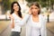 Girl Avoiding Meeting Friend Pretending Not Noticing Her Walking Outdoors