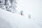 Girl in backcountry snowboarding
