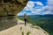 A girl on the background of the landscape of the Caucasus Mountains - The Eagle Rocks Mountain shelf, Mezmai.