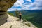 A girl on the background of the landscape of the Caucasus Mountains - The Eagle Rocks Mountain shelf, Mezmai.