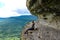 A girl on the background of the landscape of the Caucasus Mountains - The Eagle Rocks Mountain shelf, Mezmai.