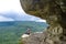 A girl on the background of the landscape of the Caucasus Mountains - The Eagle Rocks Mountain shelf, Mezmai.