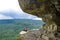 A girl on the background of the landscape of the Caucasus Mountains - The Eagle Rocks Mountain shelf, Mezmai.