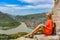 A girl on the background of a view of the Mtkvari River flowing into the Aragvi River. Mtskheta Georgia 2019