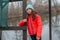 Girl on the background of winter lake or river. Girl in winter clothes on a background of the river