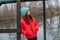Girl on the background of winter lake or river. Girl in winter clothes on a background of the river