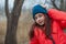 Girl on the background of winter lake or river. Girl in winter clothes on a background of the river