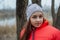 Girl on the background of winter lake or river. Girl in winter clothes on a background of the river