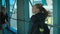 Girl with a backpack goes on the corridor at the airport.