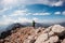 A girl with a backpack on a hike. adventure in the mountains. hiking with a backpack. girl with a backpack in the high mountains.