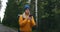 Girl with Backpack Using Smartphone Gps. Woman Hiking In The Forest And Typing Message On Smartphone. Solo female hiker
