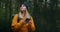 Girl with Backpack Using Smartphone Gps. Woman Hiking In The Forest And Typing Message On Smartphone. Solo female hiker
