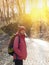 Girl with backpack walking in the Park.