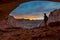 Girl Backpacker looking at beautiful sunset