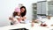 Girl baking biscuits with her mother