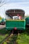 Girl balancing on train rail. Attractive young woman walking outdoors