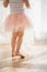 Girl in a ballet skirt. Cute little girl dreams of becoming a ballerina