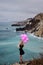 Girl with balloons against the backdrop of a stormy sea, drama e