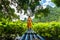 Girl on bamboo raft in lotus flower lake