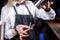 Girl barman formulates a cocktail on the brasserie