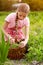 Girl with basket picking peas