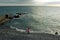 Girl on the beach, child, in a pink jacket, children play