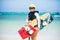 Girl at the beach with her surfboard