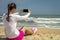 The girl on the beach makes selfie