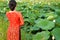 Girl in beautiful dress at lotus lake