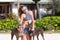 The girl beautiful in jeans shorts and an undershirt also gatsya with dogs, game with dogs on the beach.