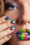 Girl with beautiful multicolor Minx nails and make-up