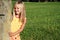 Girl behind the stone bollard