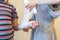 The girl bending her sister\'s hand. Two, girls, play, doctor. Bandage your arm with a bandage. Hand injury. First aid