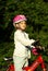 Girl With Bicycle and Helmet