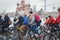 Girl on bicycle rides along of the Kremlin walls in the winter.